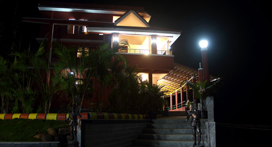 Deva Maani grand suite room enterance at night.